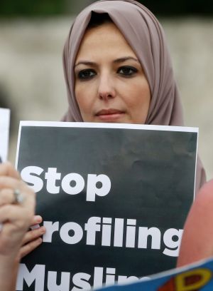 Protester Sanaa Alhagri hold a sign during a rally against President Donald Trump's executive order on Muslim ...