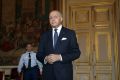 French Foreign Affairs Minister Laurent Fabius arrives to talk to the media. The French have released a draft text of a ...