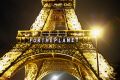 A slogan, "FOR THE PLANET", is projected on the Eiffel Tower as part of the UN Climate Conference in Paris.