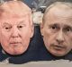 The masks of Donald Trump and the Russian President Vladimir Putin on a world map.