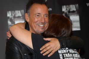 The Boss hugs a fan at a signing for his book <i>Born to Run</i> in London last year. 