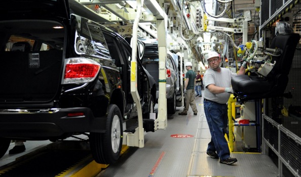 Rick Twitty installs seats into 2012 Toyota Highlander vehicles at the Toyota Motor Manufacturing Indiana, plant in ...