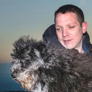 Carrickfergus man Dave Wright and his dog George at the Cavehill