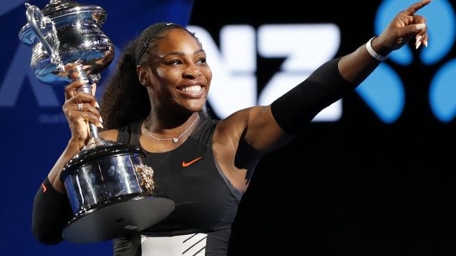 United States' Serena Williams holds her trophy after defeating her sister Venus during the women's singles final at the Australian Open tennis championships in Melbourne, Australia, Saturday, Jan. 28, 2017. (AP Photo/Dita Alangkara)