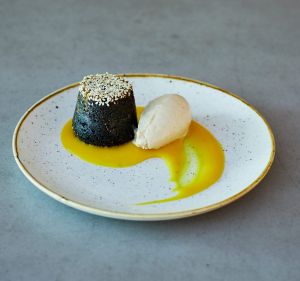 XO's black sesame cake with a yuzu curd and ginger ice cream. 