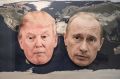 The masks of Donald Trump and the Russian President Vladimir Putin on a world map.