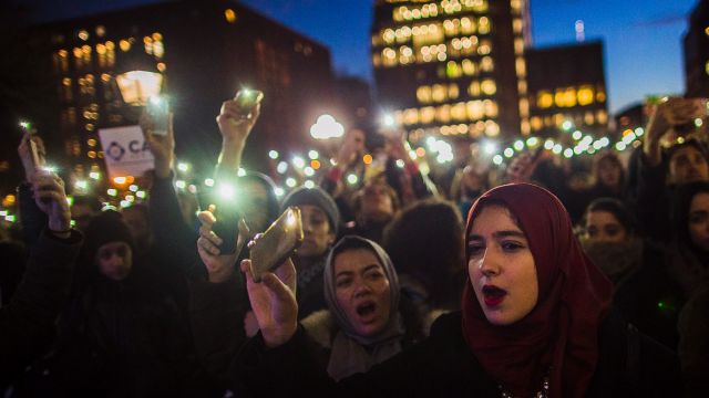 Muslim women shout slogans during a rally against President Donald Trump's order cracking down on immigrants living in ...