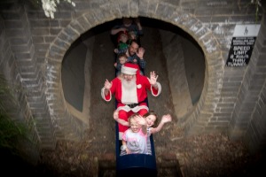 Stephen Fox, as Santa, and children at Kalparrin centre for special needs children's Christmas party.