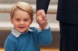 Prince George was happy to hold dad's hand.