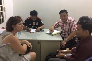 Tammy Davis-Charles being questioned by Cambodian police.