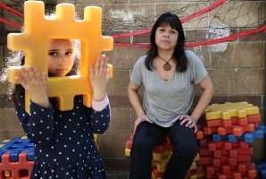 Childcare educator Patricia Rosas with five-year-old Antonella Blanco at the ABC childcare centre in Ultimo.