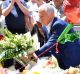 Malcolm Turnbull lays flowers in Bourke Street.