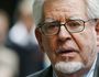 FILE - In this Monday, June 30, 2014 file photo, veteran entertainer Rolf Harris leaves the Southwark Crown Court in London. Jailed television entertainer Rolf Harris faces seven more indecent assault charges, including one on a girl under 14 at BBC headquarters. (AP Photo/Lefteris Pitarakis, file)