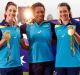 Alicia Quirk, Ellia Green and Emilee Cherry pose with their Olympic gold medals after the Australian women's sevens team ...