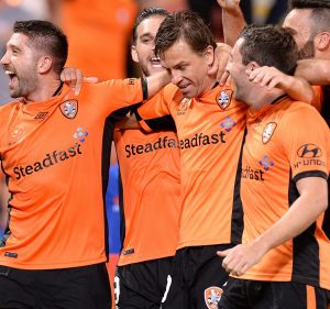 Feeling good: Brett Holman is mobbed after his decisive goal.