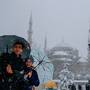 A couple takes a selfie in the Sultanahmet district, one of Istanbul's main tourist attractions, Monday, Jan. 9, 2017. (AP Photos/Emrah Gurel)