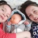 Trio: Caleb Munster with his big sisters Zoe and Naoise