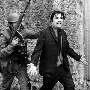 John Hume is detained by soldiers during a civil rights protest in Londonderry in August 1971.