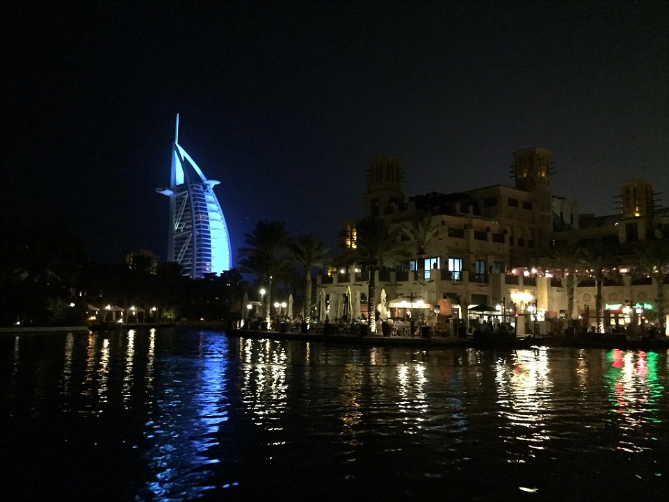 By night, Souk al Madinat Jumeirah comes alive as a complex of bars and restaurants - with the ever-present Burj Al Arab in the background