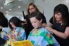 Megan Rose, Jack Brown having their hair cut by Sally Hay and Liz Rose