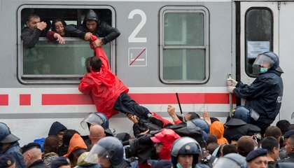 The refugees trying to enter the traing at the railway station in Tovarnik.