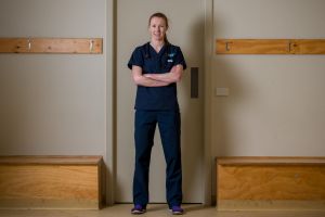 At work: Western Bulldogs player and doctor Tiarna Ernst in her hospital scrubs