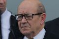 French Defence Minister Jean-Yves Le Drian (right) and Australian Defence Minister Marise Payne (left) listen to ...