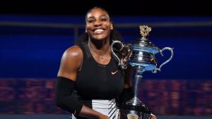 Serena Williams with the cup after beating sister Venus Williams.