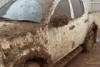 A ute covered in mud in western Queensland. 