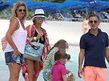 Jeremy Kyle (right) was pictured on a beach in Barbados in 2013 with his former nanny Vicky Burton (far left) and his ex-wife Carla Germaine (second left)