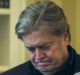 Steve Bannon, chief strategist for US President Donald Trump, stands behind Vice-President Mike Pence and White House ...