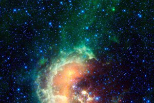 File - This infrared image from NASA's Wide-field Infrared Survey Explorer, or WISE, showcases the Tadpole Nebula, a star-forming hub in the Auriga constellation about 12,000 light-years from Earth. As WISE scanned the sky, capturing this mosaic of stitched-together frames, it happened to catch an asteroid in our solar system passing by.