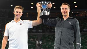 John Peers and Henri Kontinen pose with the trophy.