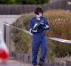 Police and forensic experts investigate after a woman and child were found dead in a house in Pascoe Vale.