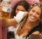 MUNICH, GERMANY - SEPTEMBER 17: Visitors hold up one-litre glasses of beer to kick off the 2016 Oktoberfest beer ...