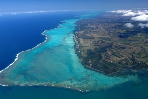 View from the top: Turquoise lagoon with saltwater channels and white sandy beach.