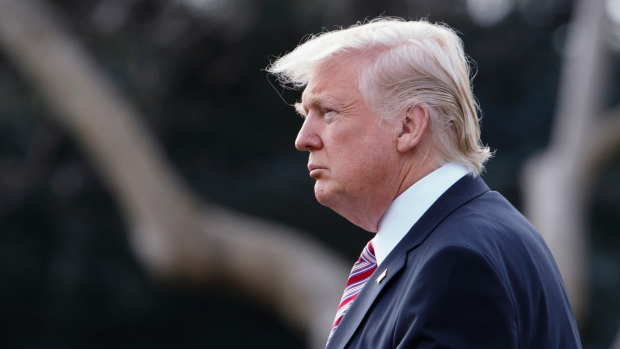 President Donald Trump walks to board Marine One on the South Lawn of the White House in Washington, Thursday, Jan. 26, 2107, for a short trip to Andrews Air Force Base, Md., then onto Philadelphia to speak at the Republican Congressional retreat. (AP Photo/Evan Vucci)