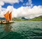 The day breaks over Hokulea with Kualoa behind her. 