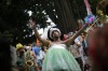 A patient from the Nise de Silveira mental health institute dances in costume during the institute's carnival parade, ...