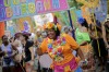 A patient from the Nise de Silveira mental health institute dances in costume during the institute's carnival parade, ...