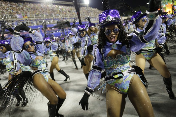 Performers from the Uniao da Ilha samba school parade during Carnival celebrations at the Sambadrome in Rio de Janeiro, ...