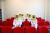 Emirates trainee flight attendants sit in protective clothing during a training session.