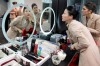 YuJung Kwon, a training instructor for Emirates Airline, left, teaches student Solenne Roussei, right, how to apply her ...