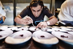 Chef Gaggan Anand plates for service. 