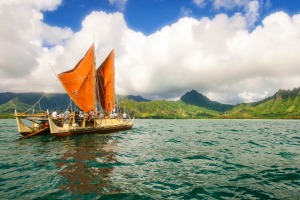 The day breaks over Hokulea with Kualoa behind her. 