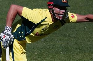 AUCKLAND, NEW ZEALAND - JANUARY 30: Marcus Stoinis of Australia makes a run as Lockie Ferguson of New Zealand looks on ...