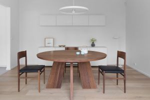 The Balwyn house's redesigned kitchen features a round oak table "that in Chinese culture neutralises any idea of a ...