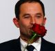 Benoit Hamon kisses a rose after winning the socialist party presidential nomination in Paris, France, Sunday, Jan. 29, ...