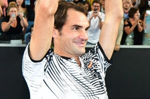 MELBOURNE, AUSTRALIA - JANUARY 29: Roger Federer of Switzerland celebrates with fans in Margaret Court Arena as he holds ...