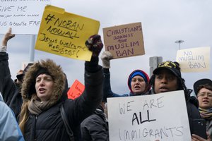 Protesters assemble at John F. Kennedy International Airport in New York, Saturday, Jan. 28, 2017 after two Iraqi refugees were detained while trying to enter the country.